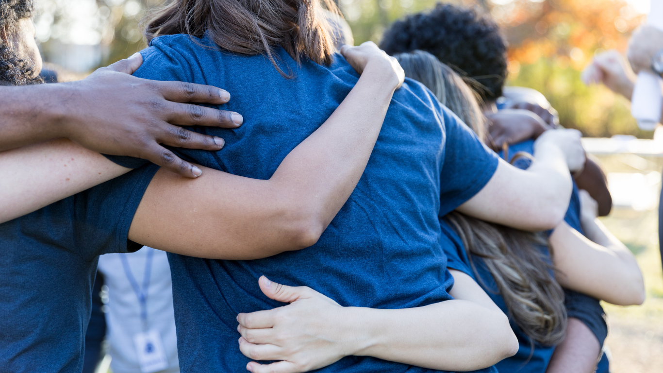 Volunteers linking arms